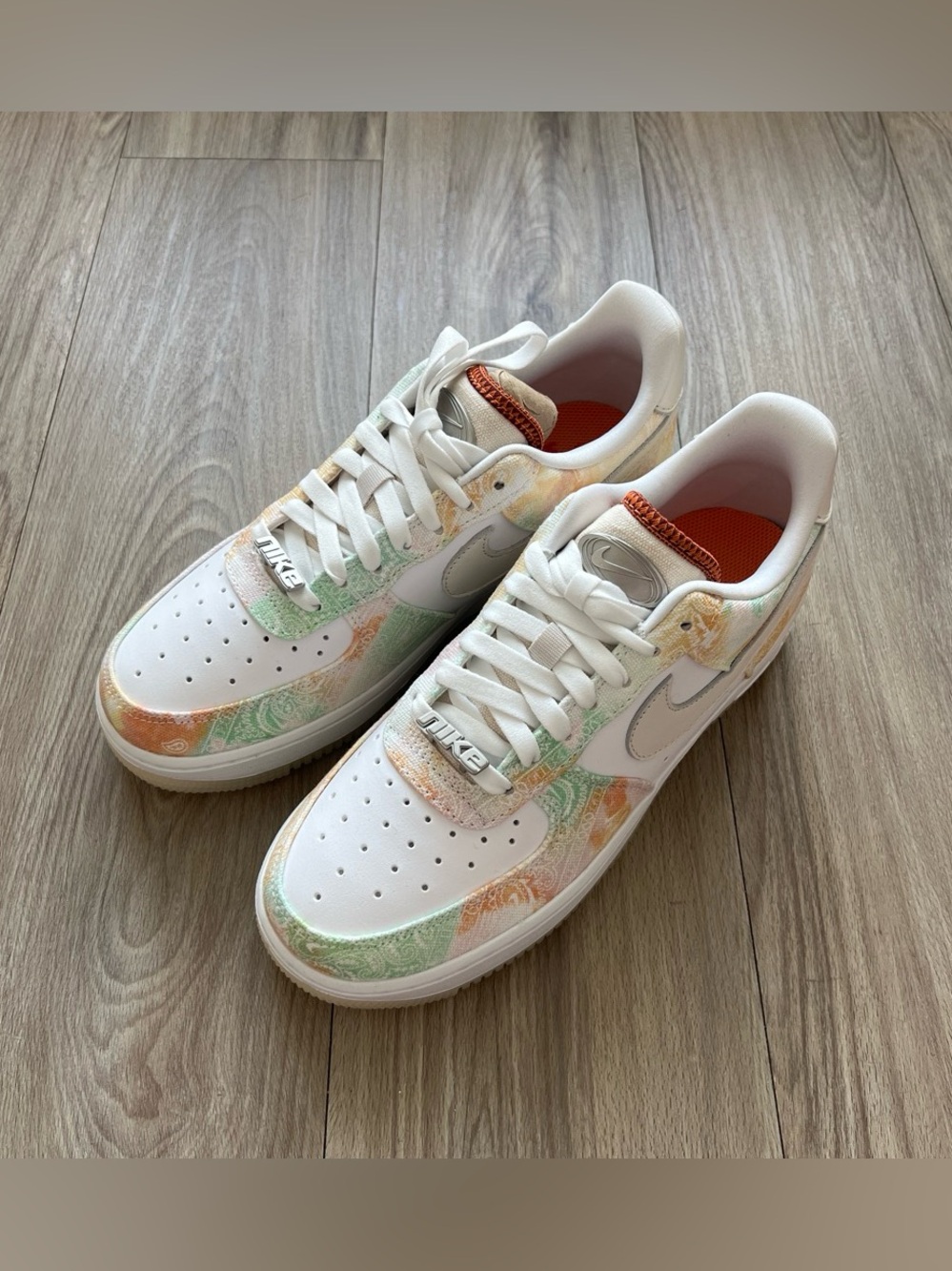 Nike Low-Top Sneakers in White with Pastel Green and Peach Accents